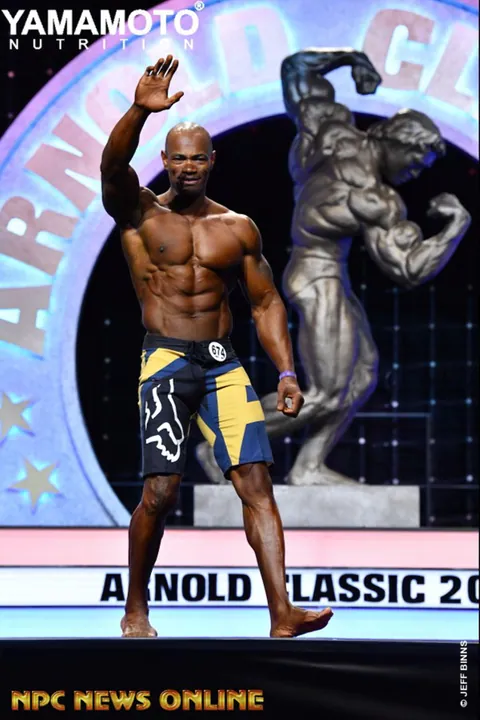Antony Bessala waving to the crowd on the Arnold Classic 2019 stage