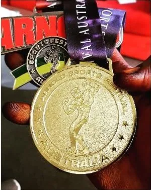 Close-up of the gold Arnold Sports Festival Australia medal