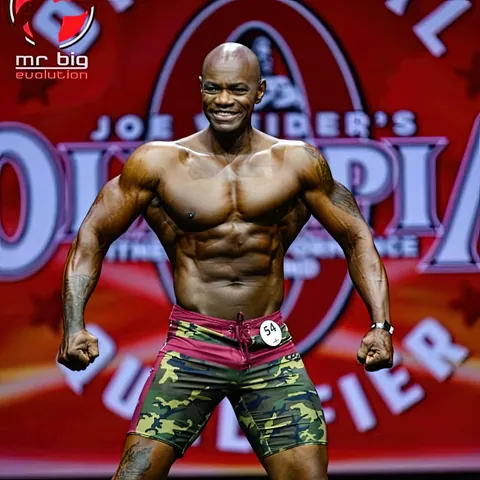 Antony Bessala in camouflage shorts on the Mr Big Evolution Olympia qualifier stage