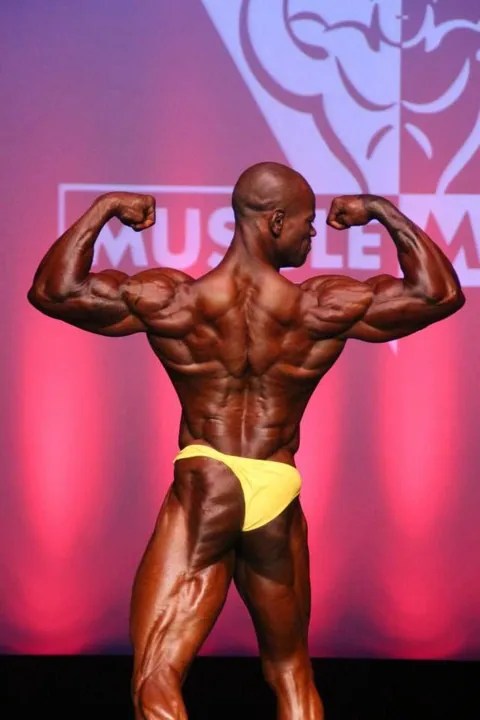 Antony Bessala on the Musclemania Pro stage: back double biceps