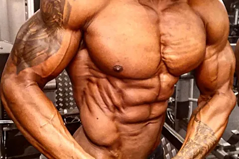 Close-up of Antony Bessala's chest and abs